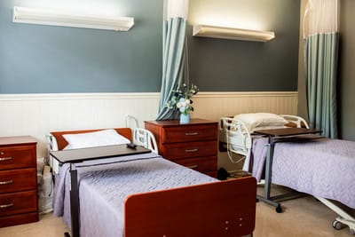 Bright interior of a shared bedroom in a nursing facility