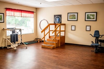 Bright therapy room with equipment and decorations