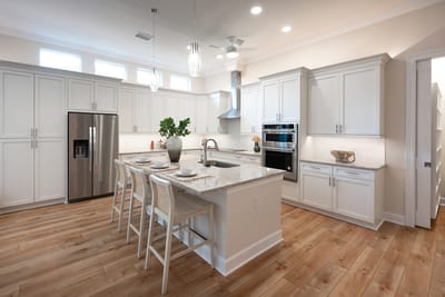 Modern kitchen with white cabinets and granite countertops