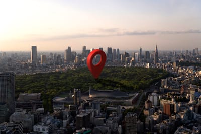Aerial view of a city with a green park