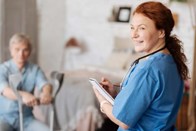 Staff member interacting with a resident in a private room