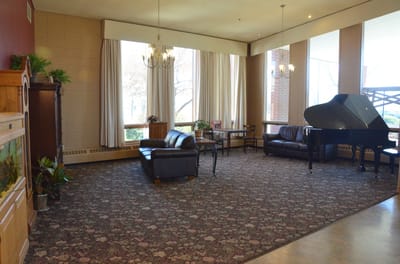 Interior common area with seating and a piano