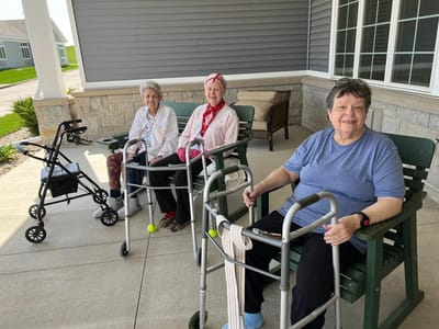 Residents enjoying time outdoors on the patio