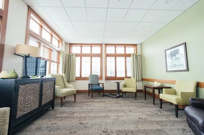 Bright interior common area with furniture and windows