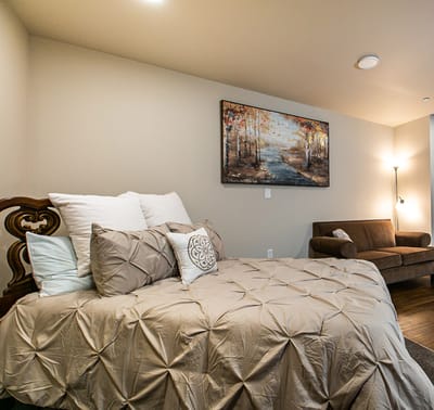 Cozy private bedroom with a painting