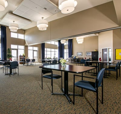 Bright common area with tables and chairs