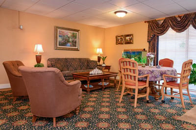 Cozy common area with seating and an aquarium