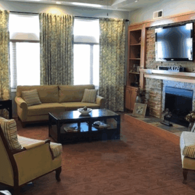 Cozy common area with couches and a fireplace