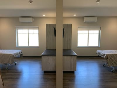 Interior view of a shared resident room with beds