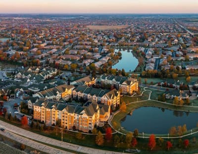Aerial view of a senior living community with lakes