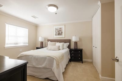 Well-furnished bedroom in a senior living facility