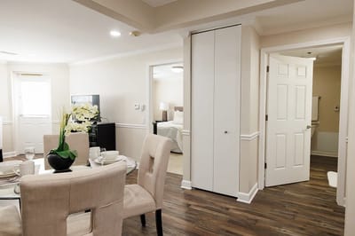 Bright, well-furnished facility interior with dining area