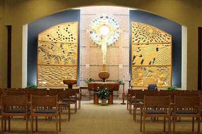 Interior view of a serene chapel with wooden decorations