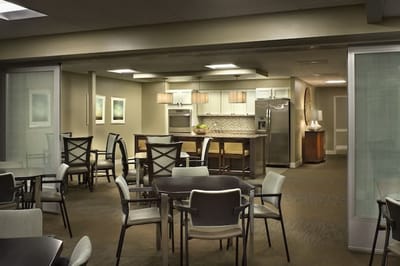Common area with a kitchen and dining tables