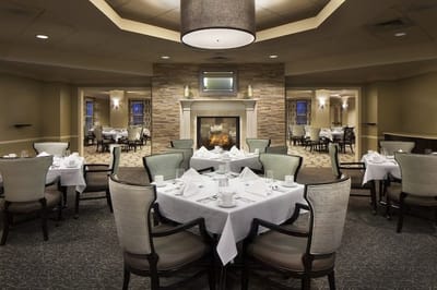 Elegant dining room with tables set for meals