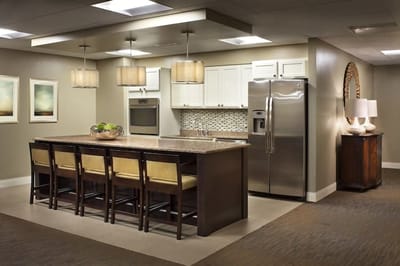 Modern kitchen interior with seating and appliances