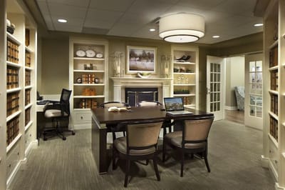 Cozy interior reading area with bookshelves and seating