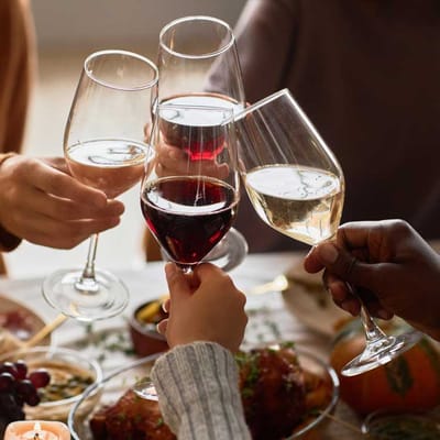 Residents toasting with glasses at a festive gathering