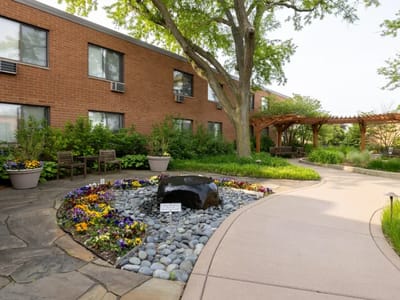 Pathway with landscaped gardens and building exterior