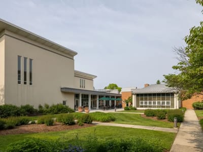 Exterior view of a senior living facility with landscaping