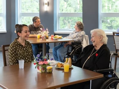 Residents enjoying a meal in the dining area