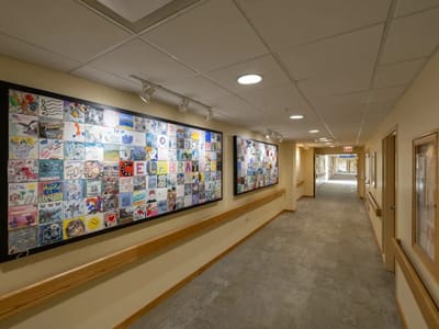 Colorful artwork displayed in a hallway