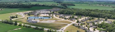 Aerial view of a senior living facility with green space