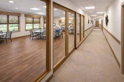 Interior hallway view with activity room in background