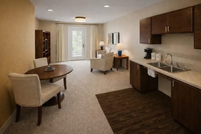 Bright interior of a resident room with kitchen area