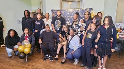 Residents and family gathering for a celebration indoors