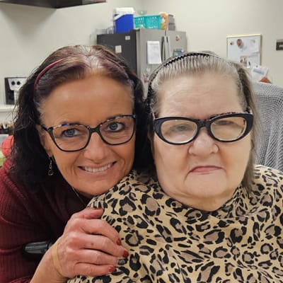 Staff member with a resident in a warm setting