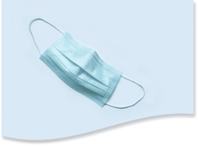 Single disposable face mask on a soft background