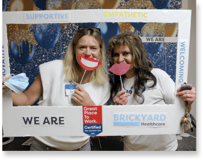 Staff members playfully posing in a common area