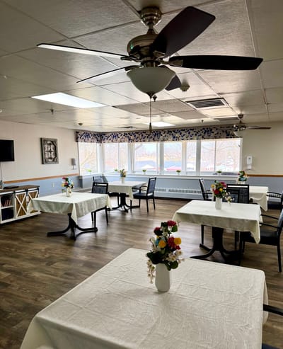 Bright dining area with flower centerpieces
