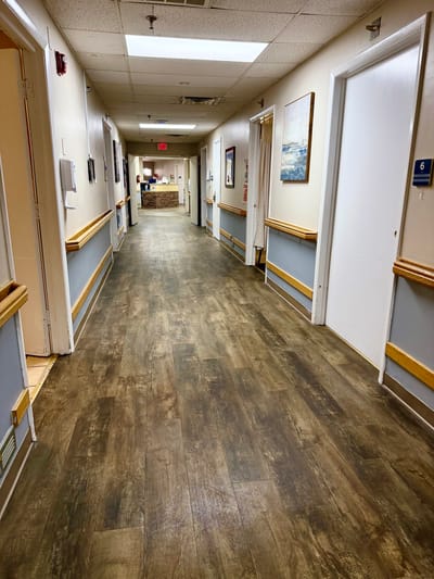 Residential hallway with doors and artwork