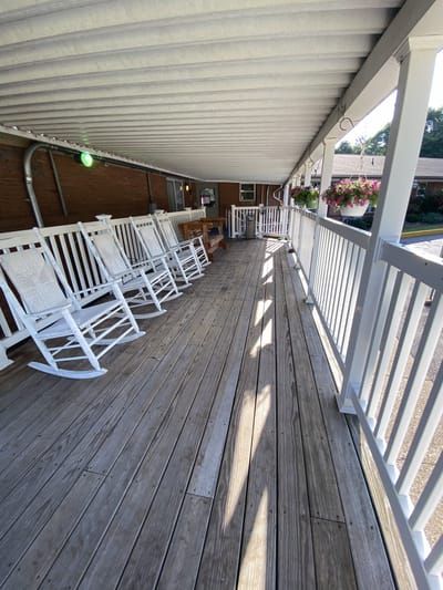 Porch with rocking chairs and wooden decking