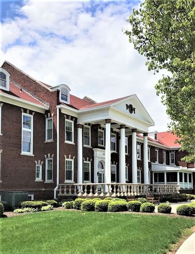 Exterior view of a senior living facility with columns