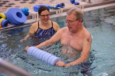 Residents participating in a water exercise class