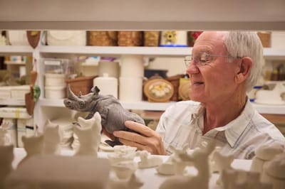 Resident enjoying pottery in an activity room