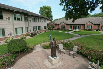 Garden area with a statue and accessible seating