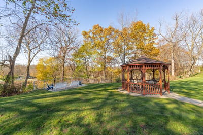 A gazebo in a lush green outdoor area