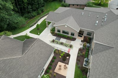 Aerial view of a senior living facility courtyard and pathways