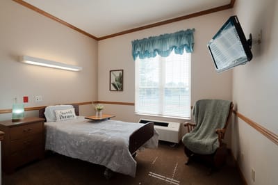 Cozy resident room with a bed and window