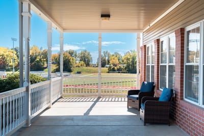 Covered porch area with outdoor seating