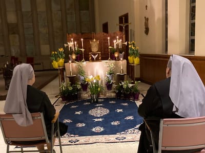 Two residents in a serene chapel setting