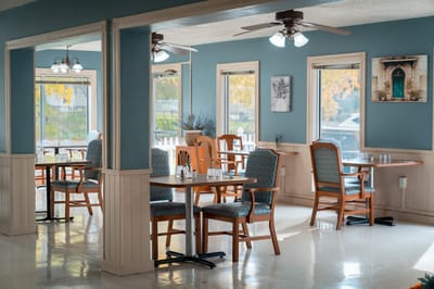 Bright dining room with wooden tables and chairs