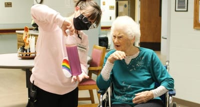 Staff member engaging with resident in a common area