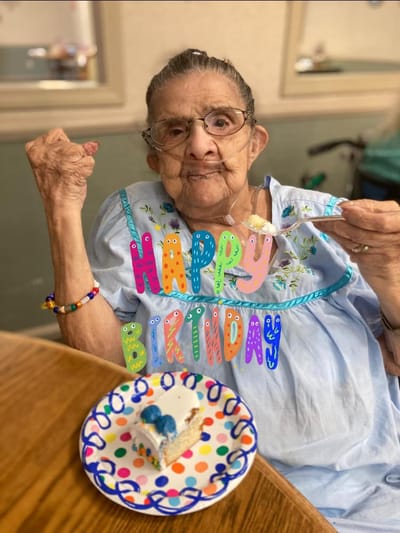 Resident celebrating birthday with cake