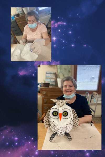 Residents engaging in a crafting activity indoors