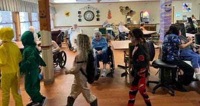 Residents participating in a costume event in the common area